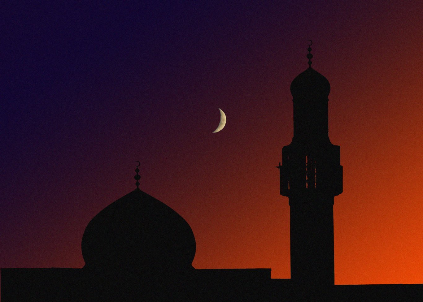 Crescent moon over a mosque